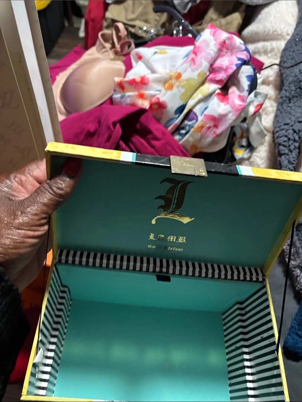 Cartier red and gold jewelry box with decorative trim/L.A.M.B fr by Gwen Stefani